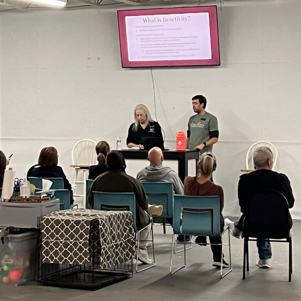 John speaking to dog owners during a presentation about canine reactivity