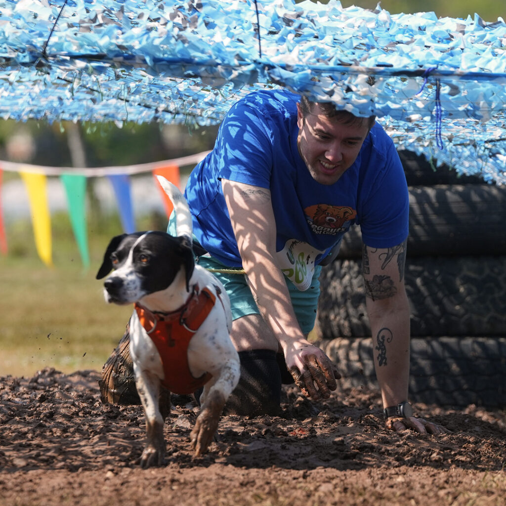 John Hay and Shiloh completing an outdoor obstacle course together
